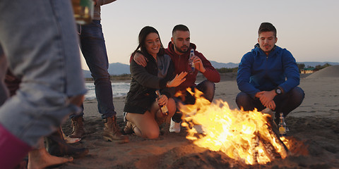 Image showing Friends having fun at beach on autumn day