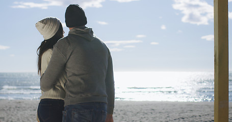 Image showing Couple having fun on beautiful autumn day at beach