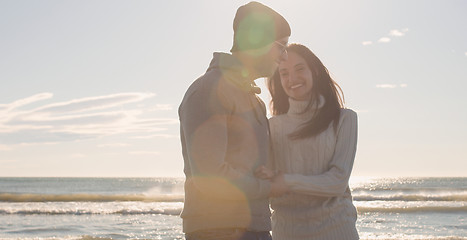 Image showing Couple having fun on beautiful autumn day at beach