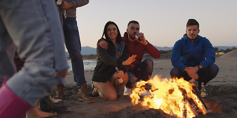 Image showing Friends having fun at beach on autumn day