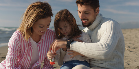 Image showing Young family enjoying vecation during autumn