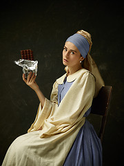 Image showing Medieval Woman in Historical Costume Wearing Corset Dress and Bonnet.