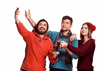 Image showing Smiling european men and women during party photoshoot.