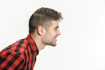 Image showing The happy business man standing and smiling against pink background.