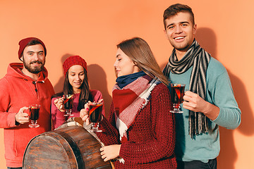 Image showing Smiling european men and women during party photoshoot.