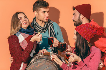 Image showing Smiling european men and women during party photoshoot.