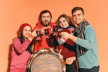 Image showing Smiling european men and women during party photoshoot.