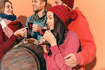 Image showing Smiling european men and women during party photoshoot.