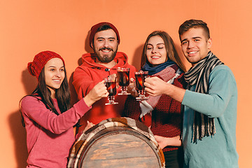 Image showing Smiling european men and women during party photoshoot.