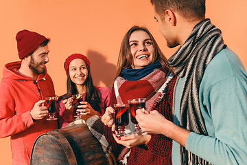 Image showing Smiling european men and women during party photoshoot.