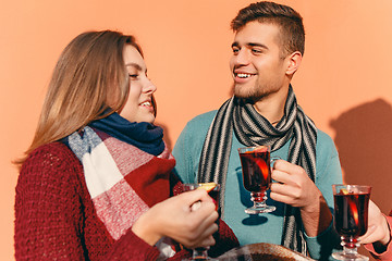 Image showing Smiling european men and women during party photoshoot.