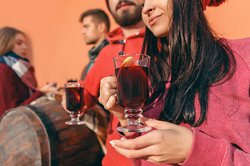 Image showing Smiling european men and women during party photoshoot.