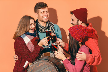 Image showing Smiling european men and women during party photoshoot.