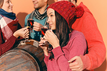 Image showing Smiling european men and women during party photoshoot.