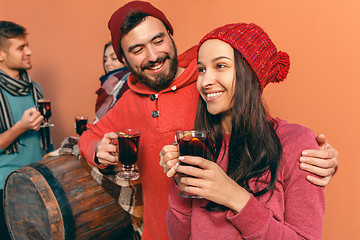 Image showing Smiling european men and women during party photoshoot.