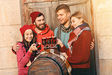 Image showing Smiling european men and women during party photoshoot.