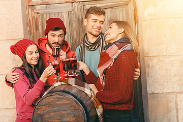 Image showing Smiling european men and women during party photoshoot.