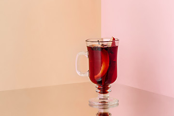 Image showing Mulled wine in glass on on the glass table