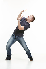 Image showing young cool man full body scared pose.