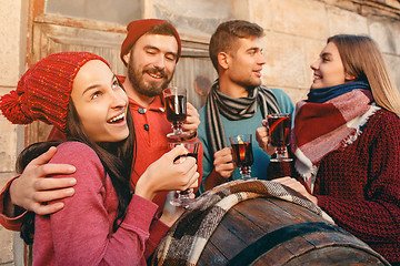 Image showing Smiling european men and women during party photoshoot.