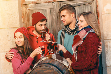 Image showing Smiling european men and women during party photoshoot.