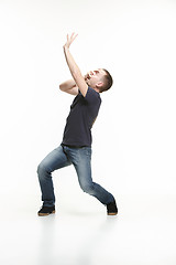 Image showing young cool man full body scared pose.