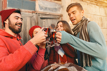 Image showing Smiling european men and women during party photoshoot.