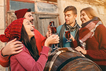 Image showing Smiling european men and women during party photoshoot.