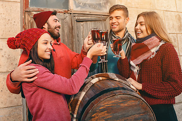 Image showing Smiling european men and women during party photoshoot.