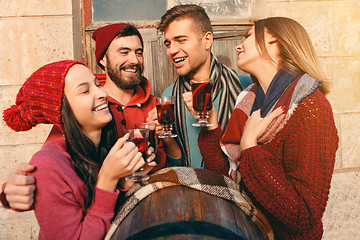Image showing Smiling european men and women during party photoshoot.