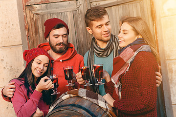 Image showing Smiling european men and women during party photoshoot.