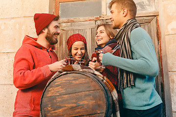 Image showing Smiling european men and women during party photoshoot.