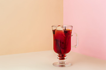 Image showing Mulled wine in glass on on the glass table