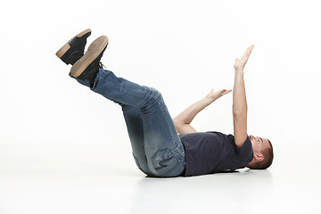 Image showing young cool man full body scared pose.