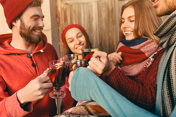 Image showing Smiling european men and women during party photoshoot.