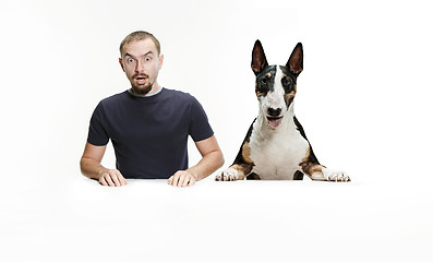 Image showing Emotional Portrait of a man and his shepherd dog, concept of friendship and care of man and animal