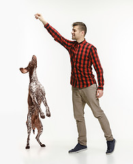 Image showing Emotional Portrait of a man and his dog, concept of friendship and care of man and animal