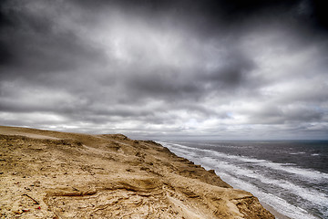 Image showing Cloudy weather over a rough coastline