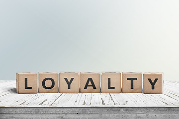 Image showing Loyalty sign on a wooden table in bright daylight