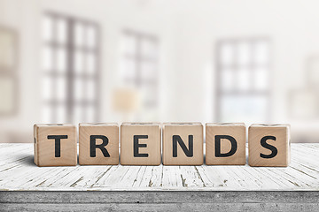 Image showing Trends sign in a bright home on a wooden desk