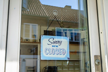 Image showing Closed sign hanging in a store window