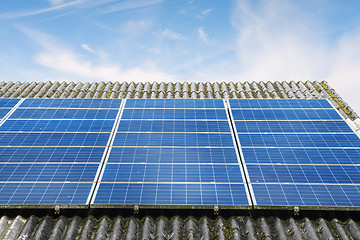 Image showing Solar panels in blue color on a roof