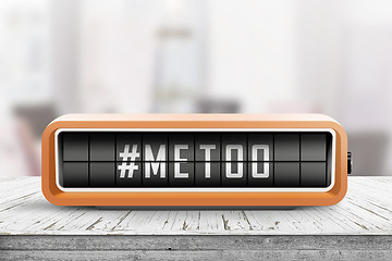 Image showing Metoo hashtag message on a retro alarm device