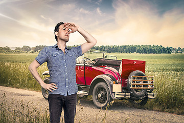 Image showing Car out of fuel in a rural countryside with a male