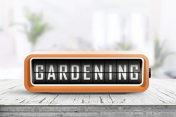 Image showing Gardening alarm message in a bright room in the spring