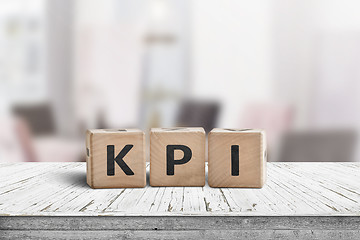 Image showing KPI word on a wooden sign in a bright environment