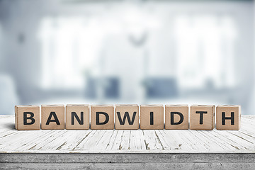 Image showing Bandwidth sign in a living room on a wooden desk