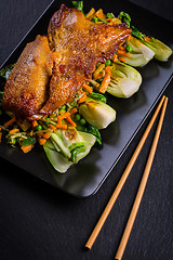 Image showing Peking duck breast with pak choi and vegetables