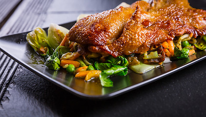 Image showing Peking duck breast with pak choi and vegetables