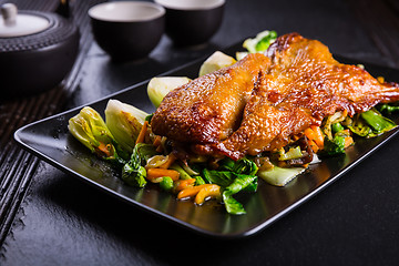 Image showing Peking duck breast with pak choi and vegetables